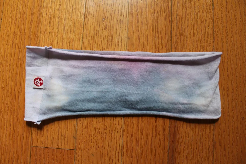 Lavender and blue tie-dye yoga headband, a sweat-wicking pick for what to bring to a hot yoga class